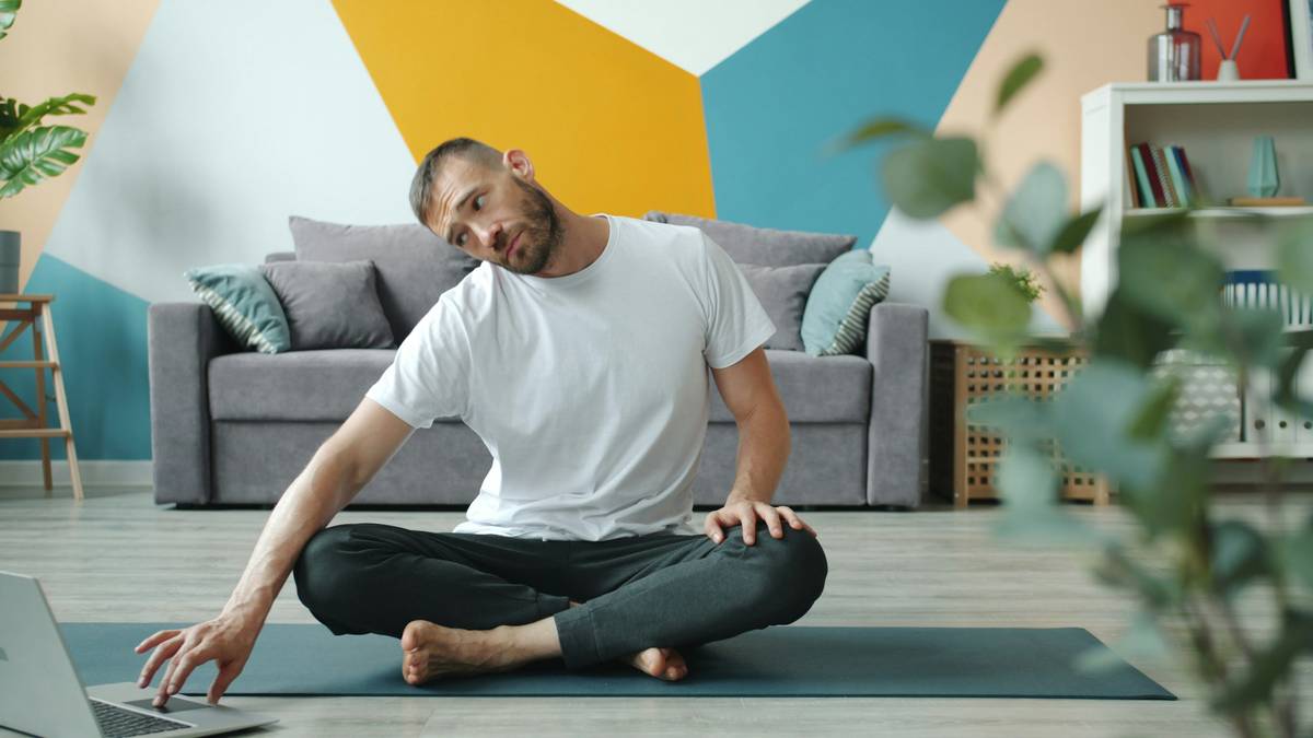 home chronic pain recovery tools laid out on a table including foam roller, resistance bands, and heat pack