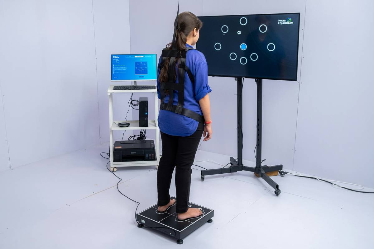 rehab equipment tool what is therapeutic: woman using resistance bands during physical therapy session at home